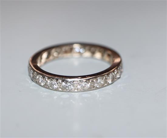 A white metal and diamond set full eternity ring, size P/Q.